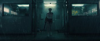 Movie still from “Birds of Prey” (2020), directed by Cathy Yan – A person holding a baseball bat inside of a building; Wide shot, Low angle