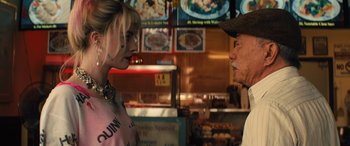 Movie still from “Birds of Prey” (2020), directed by Cathy Yan – A man and a woman talking in front of each other; Close Up shot, Over the shoulder angle