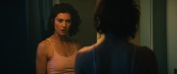 Movie still from “Birds of Prey” (2020), directed by Cathy Yan – A woman looking into a mirror in front of a mirror; Close Up shot, Over the shoulder angle