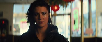 Movie still from “Birds of Prey” (2020), directed by Cathy Yan – A person wearing a black jacket; Close Up shot, Over the shoulder angle