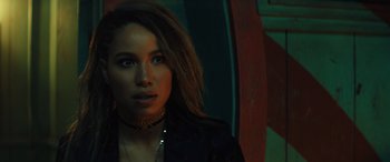 Movie still from “Birds of Prey” (2020), directed by Cathy Yan – A woman with long hair wearing a black jacket; Close Up shot, Over the shoulder angle