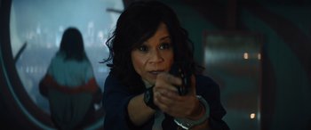 Movie still from “Birds of Prey” (2020), directed by Cathy Yan – A woman holding a gun in her hand; Close Up shot, Low angle