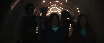 Movie still from “Birds of Prey” (2020), directed by Cathy Yan – A group of women standing in a tunnel; Medium shot, Over the shoulder angle