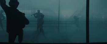 Movie still from “Birds of Prey” (2020), directed by Cathy Yan – Two people are walking in the fog on a bridge; Wide shot, Low angle