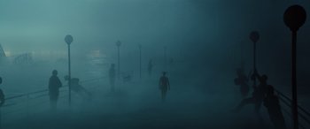 Movie still from “Birds of Prey” (2020), directed by Cathy Yan – A group of people walking on a pier in the fog; Extreme Wide shot, High angle