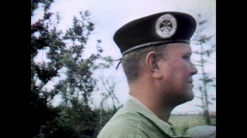 Movie still from “Bitchin': The Sound and Fury of Rick James” (2021), directed by Sacha Jenkins – An older man wearing a hat and a green shirt; Close Up shot, Low angle
