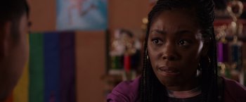 Movie still from “Black as Night” (2021), directed by Maritte Lee Go – A person with a purple shirt; Close Up shot, Over the shoulder angle