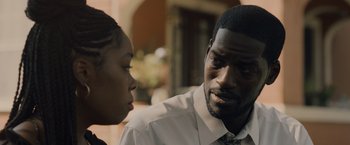 Movie still from “Black as Night” (2021), directed by Maritte Lee Go – A man and a woman talking to each other; Close Up shot, Over the shoulder angle