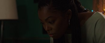 Movie still from “Black as Night” (2021), directed by Maritte Lee Go – A person looking down at the ground; Close Up shot, High angle