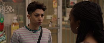 Movie still from “Black as Night” (2021), directed by Maritte Lee Go – A young man in striped shirt talking to a woman; Close Up shot, Over the shoulder angle