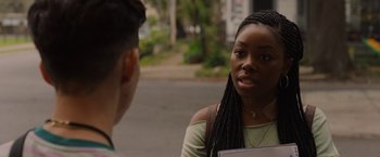 Movie still from “Black as Night” (2021), directed by Maritte Lee Go – A woman is talking to another woman on the street; Close Up shot, Over the shoulder angle