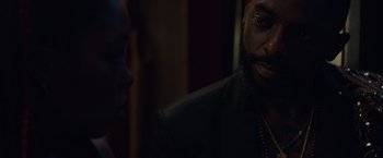 Movie still from “Black as Night” (2021), directed by Maritte Lee Go – A man and a woman are talking to each other in a dark room; Close Up shot, Over the shoulder angle