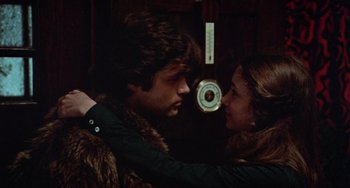 Movie still from “Black Christmas” (1974), directed by Bob Clark – A man and a woman standing next to each other; Close Up shot, High angle