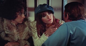 Movie still from “Black Christmas” (1974), directed by Bob Clark – A woman wearing a hat and a fur coat; Close Up shot, Over the shoulder angle