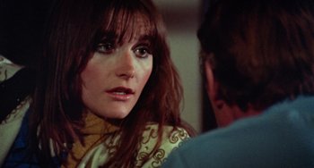 Movie still from “Black Christmas” (1974), directed by Bob Clark – A person talking to another person; Close Up shot, Over the shoulder angle