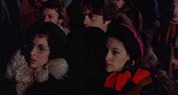 Movie still from “Black Christmas” (1974), directed by Bob Clark – A group of people sitting in a room together; Close Up shot, High angle