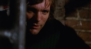 Movie still from “Black Christmas” (1974), directed by Bob Clark – A person looking at the camera; Close Up shot, Overhead angle