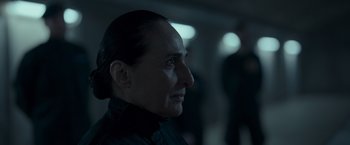 Movie still from “Black Crab” (2022), directed by Adam Berg – A person's face in a dark room; Close Up shot, Over the shoulder angle