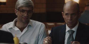 Movie still from “BlackBerry” (2023), directed by Matt Johnson – Two men sitting next to each other at a table; Close Up shot, Over the shoulder angle
