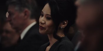 Movie still from “BlackBerry” (2023), directed by Matt Johnson – A person wearing a suit; Close Up shot, Over the shoulder angle