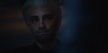 Movie still from “BlackBerry” (2023), directed by Matt Johnson – A person wearing a black shirt; Close Up shot, Over the shoulder angle