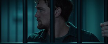 Movie still from “Blacklight” (2022), directed by Mark Williams – A person with a beard; Close Up shot, Low angle