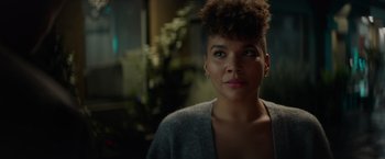 Movie still from “Blacklight” (2022), directed by Mark Williams – A person wearing a sweater; Close Up shot, Over the shoulder angle