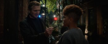 Movie still from “Blacklight” (2022), directed by Mark Williams – A man and a woman talking to each other; Close Up shot, Over the shoulder angle