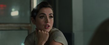 Movie still from “Blade Runner 2049” (2017), directed by Denis Villeneuve – A beautiful young lady sitting in front of a window; Close Up shot, Over the shoulder angle