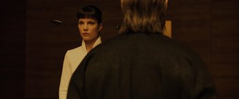 Movie still from “Blade Runner 2049” (2017), directed by Denis Villeneuve – A woman standing in front of a mirror looking at a man; Close Up shot, Over the shoulder angle