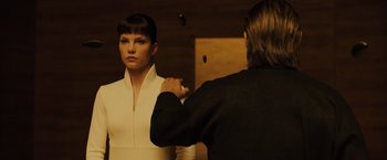 Movie still from “Blade Runner 2049” (2017), directed by Denis Villeneuve – A woman in a white dress looking in a mirror; Medium shot, Over the shoulder angle