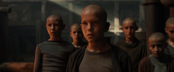 Movie still from “Blade Runner 2049” (2017), directed by Denis Villeneuve – A group of young men standing next to each other in a room; Close Up shot, Low angle