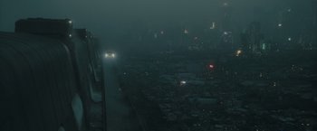 Movie still from “Blade Runner 2049” (2017), directed by Denis Villeneuve – A car driving on a road in the middle of the night; Extreme Wide shot, Overhead angle