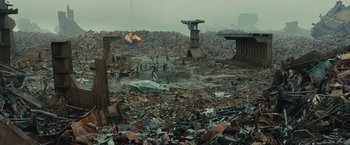 Movie still from “Blade Runner 2049” (2017), directed by Denis Villeneuve – People are standing in a pile of rubble; Extreme Wide shot, High angle