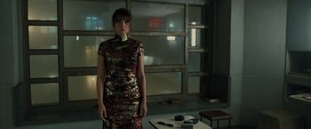 Movie still from “Blade Runner 2049” (2017), directed by Denis Villeneuve – A woman standing in front of a window in a room; Medium shot, Low angle