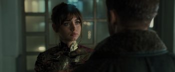 Movie still from “Blade Runner 2049” (2017), directed by Denis Villeneuve – A woman is looking at a man in the mirror; Close Up shot, Over the shoulder angle