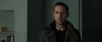 Movie still from “Blade Runner 2049” (2017), directed by Denis Villeneuve – A person wearing a jacket; Close Up shot, Low angle