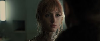 Movie still from “Blade Runner 2049” (2017), directed by Denis Villeneuve – A person wearing a dress; Close Up shot, Over the shoulder angle