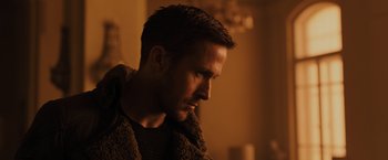 Movie still from “Blade Runner 2049” (2017), directed by Denis Villeneuve – A person wearing a jacket; Close Up shot, Low angle