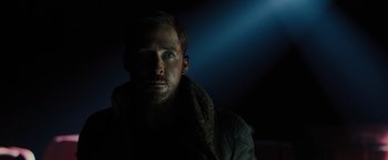 Movie still from “Blade Runner 2049” (2017), directed by Denis Villeneuve – A person wearing a jacket; Close Up shot, Low angle