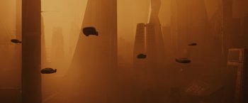 Movie still from “Blade Runner 2049” (2017), directed by Denis Villeneuve – A car is flying through the air in a foggy city; Extreme Wide shot, Low angle
