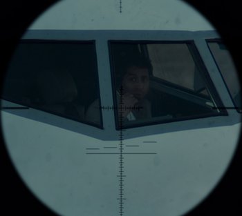 Movie still from “Blood Red Sky” (2021), directed by Peter Thorwarth – A man sitting in a car looking out the window; Extreme Close Up shot, Overhead angle
