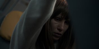 Movie still from “Blood Red Sky” (2021), directed by Peter Thorwarth – A person with long brown hair; Close Up shot, Low angle