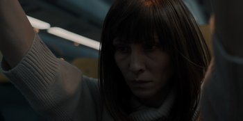 Movie still from “Blood Red Sky” (2021), directed by Peter Thorwarth – A person with long brown hair; Close Up shot, Low angle