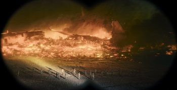 Movie still from “Blood Red Sky” (2021), directed by Peter Thorwarth – A fire is burning in the middle of the night; Extreme Wide shot, High angle