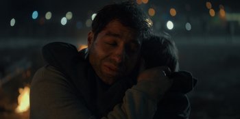 Movie still from “Blood Red Sky” (2021), directed by Peter Thorwarth – A person hugging another person; Close Up shot, Over the shoulder angle