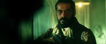 Movie still from “Bloodshot” (2020), directed by Dave Wilson – A man with a beard is looking at the camera; Close Up shot, Low angle