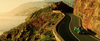 Movie still from “Bloodshot” (2020), directed by Dave Wilson – A view of a road on the side of a mountain; Extreme Wide shot, High angle