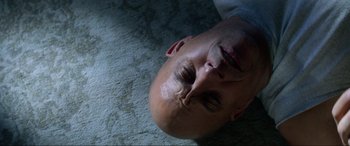 Movie still from “Bloodshot” (2020), directed by Dave Wilson – A man laying on the ground with his eyes closed; Close Up shot, Overhead angle