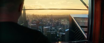 Movie still from “Bloodshot” (2020), directed by Dave Wilson – A view of a large city from a skyscraper window; Medium shot, Low angle